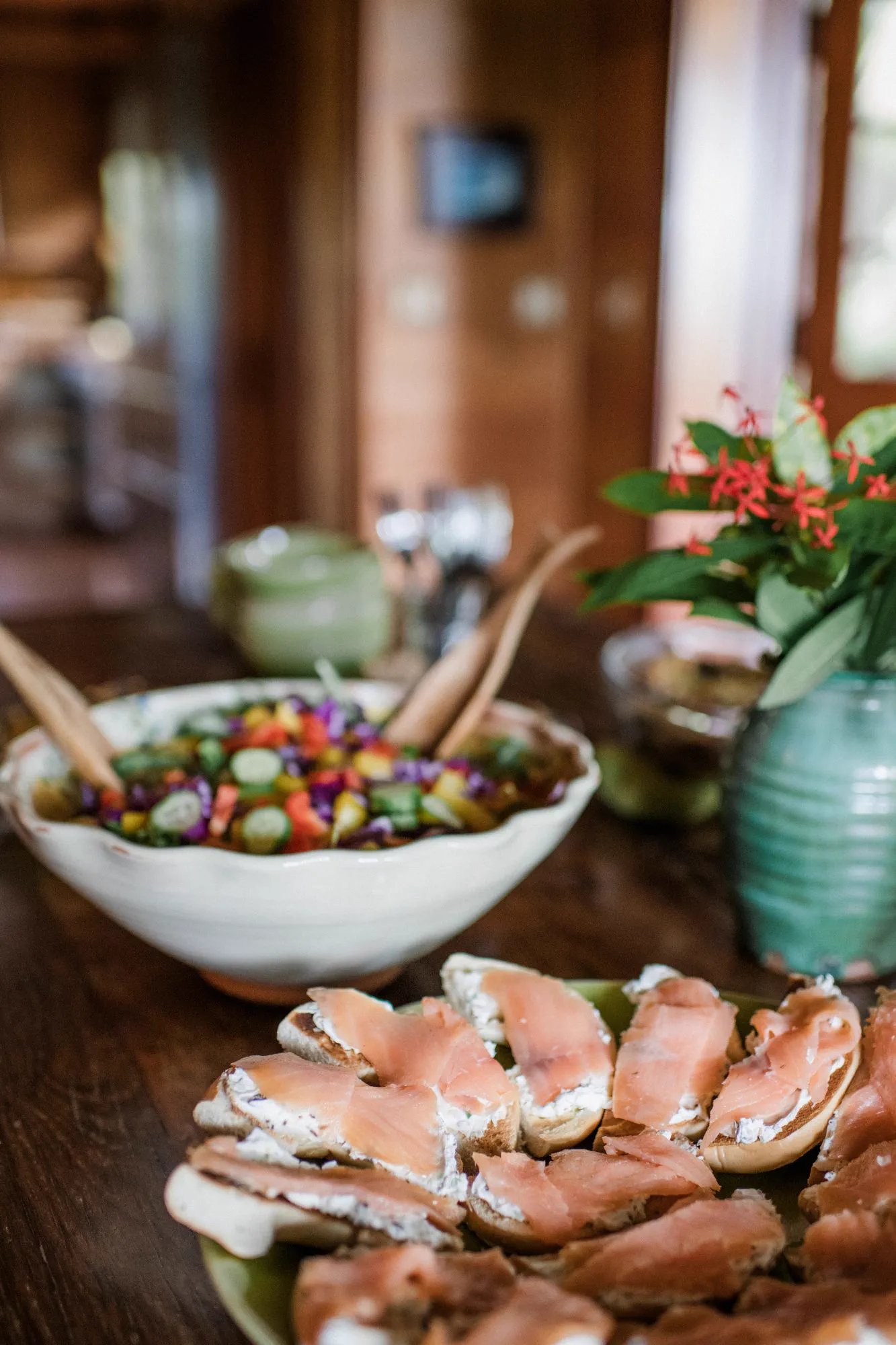 A buffet of fresh salad and salmon laid out for lunch.